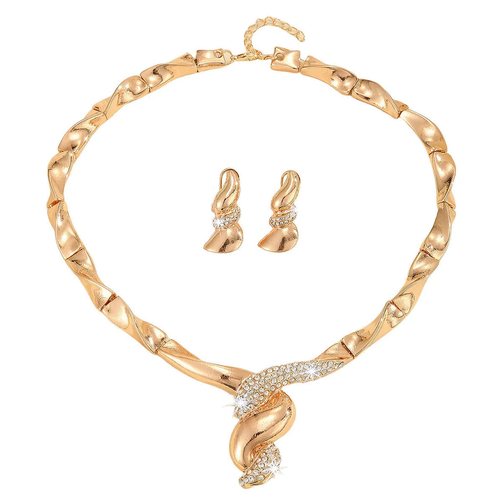 Gold alloy thread necklace and earrings suite with love heart pattern on a white background
