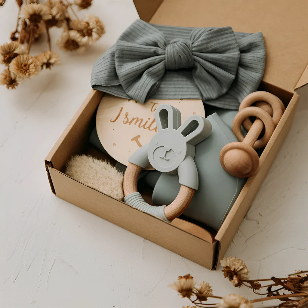 Set of six baby bath toys in peach, blue, and brown colours made from wood and chemical fibre