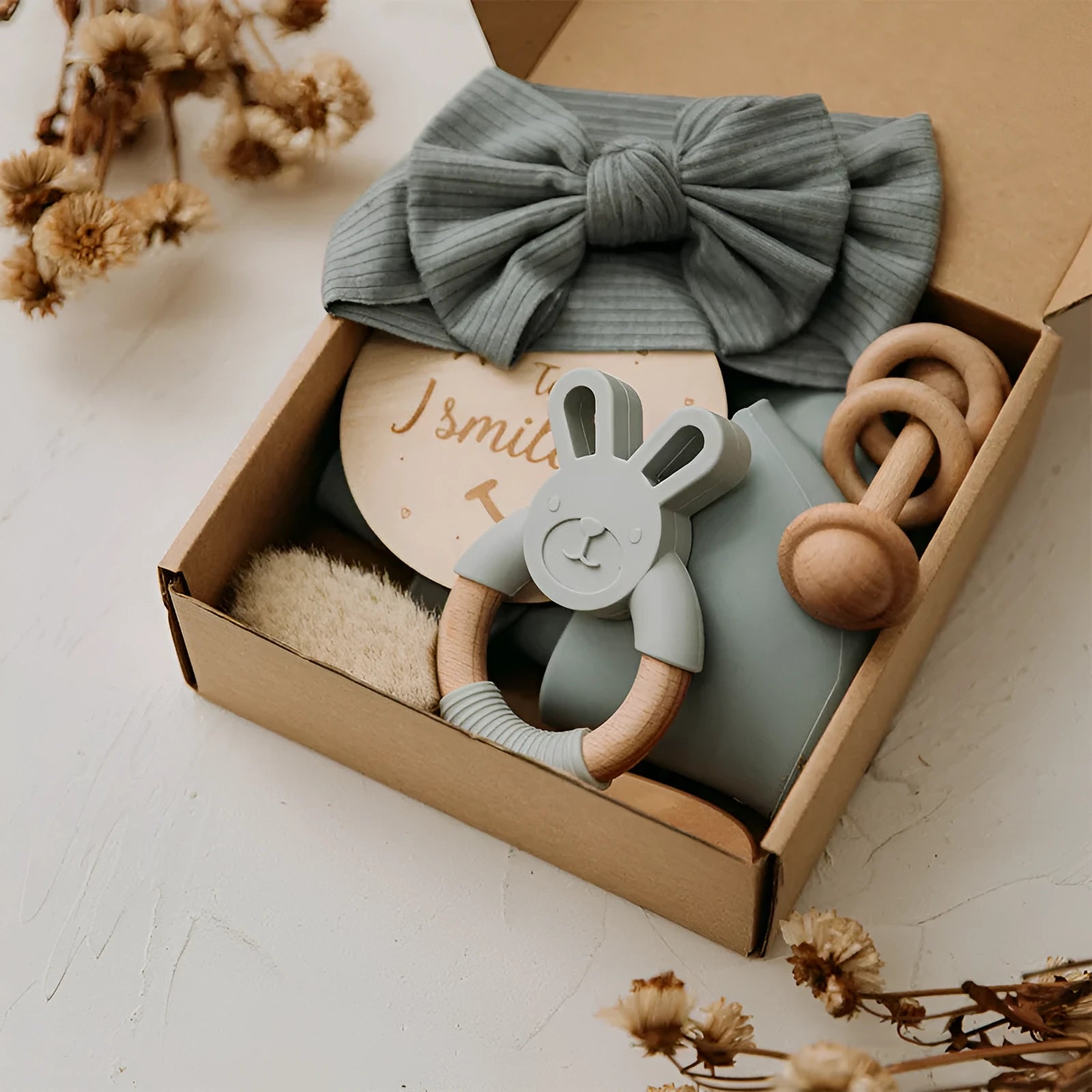 Set of six baby bath toys in peach, blue, and brown colours made from wood and chemical fibre