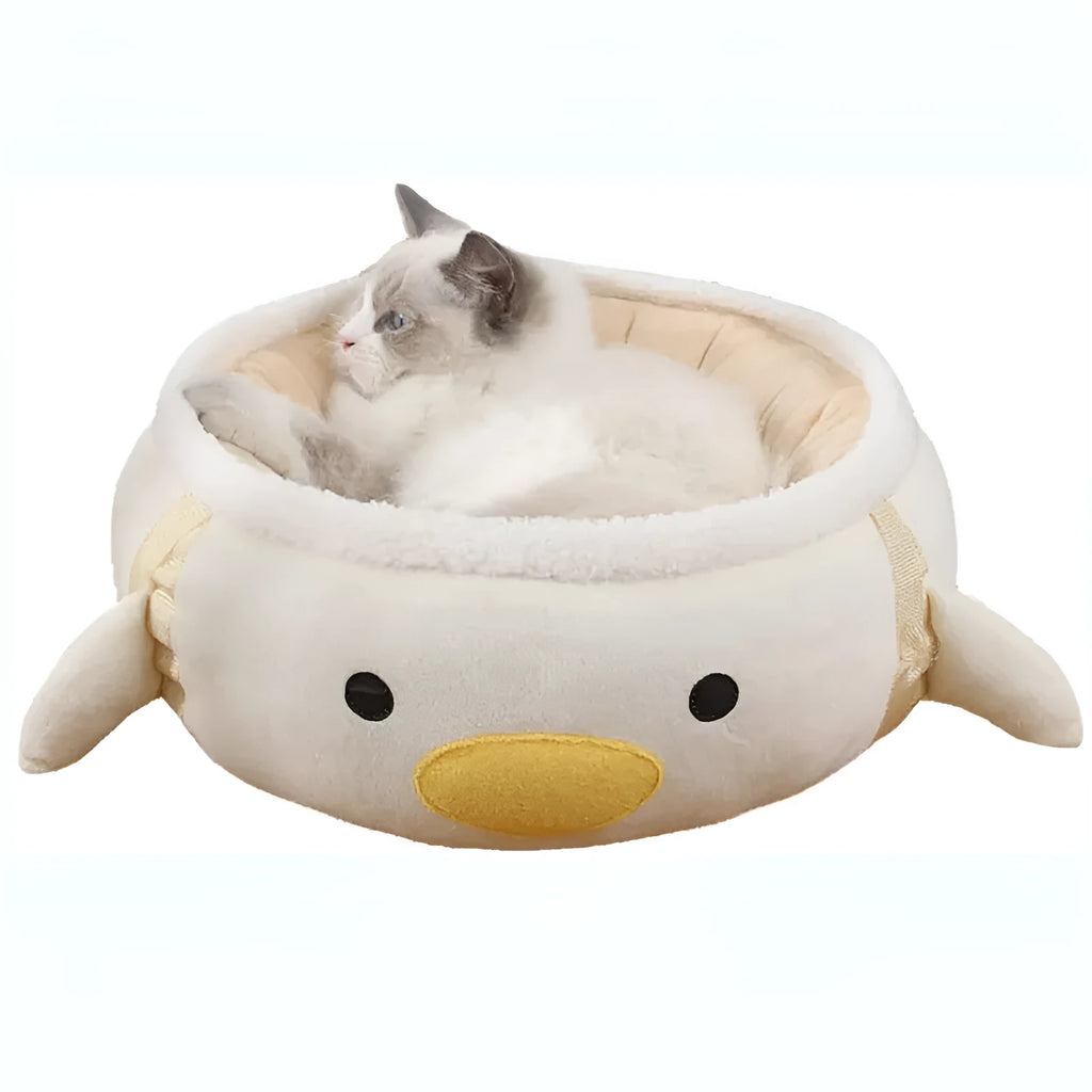 Green chick-shaped cat bed shown both flat as a sofa and hanging as a hammock for a small cat.