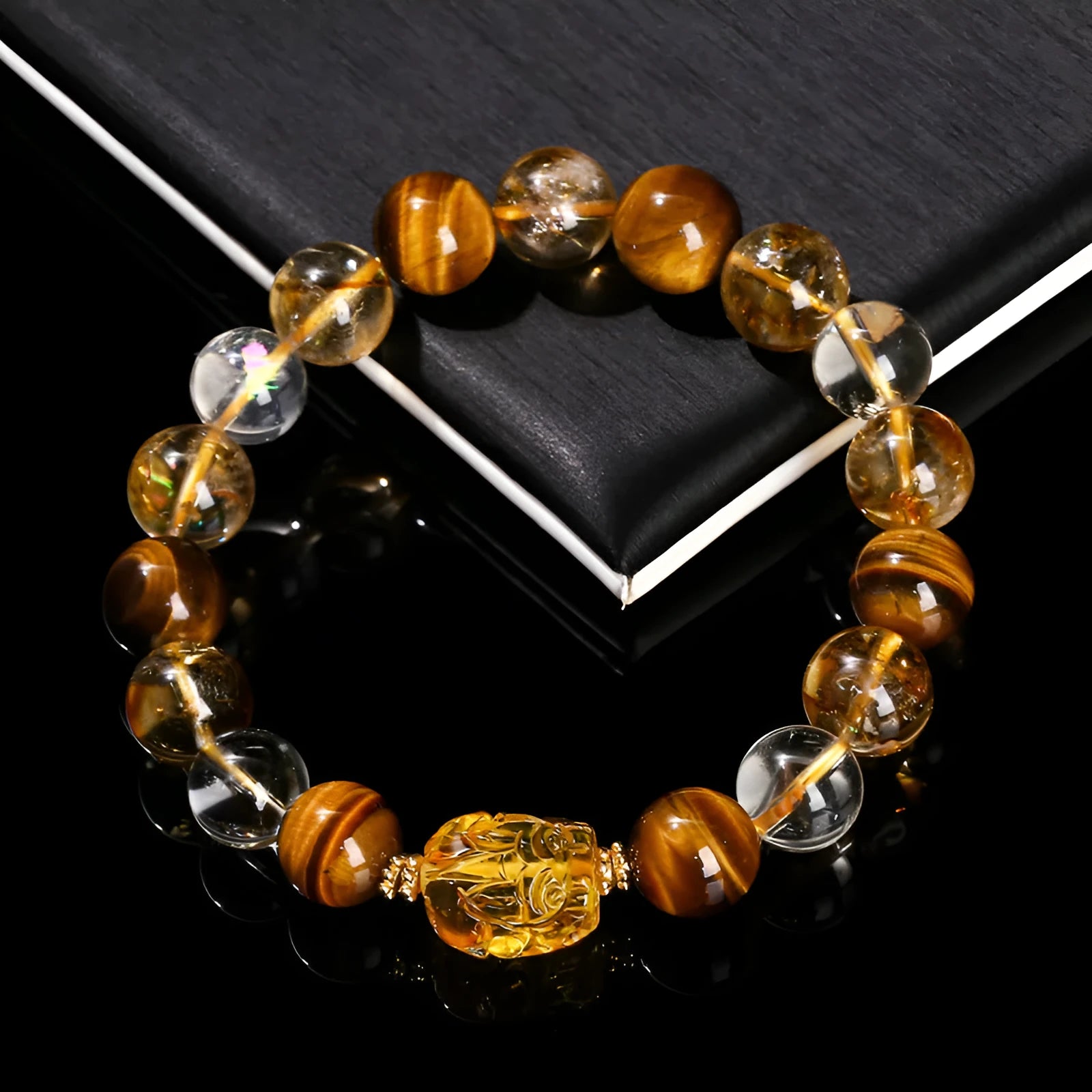 Natural yellow tiger's eye and citrine gemstone bracelet with 10mm beads and a steel Pi Xiu charm.