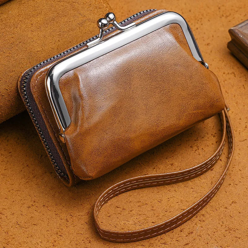 Ladies' 4-inch leather alternative coin purse with a metal clip buckle, shown in jujube red.