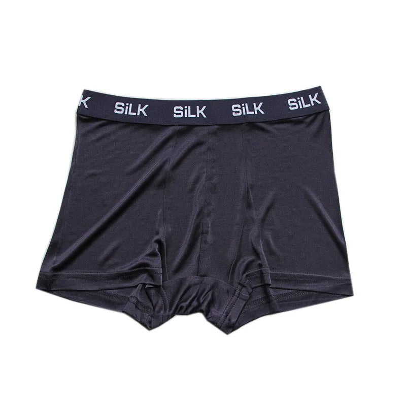 Men's loose fit silk shorts in navy blue, skin colour, and silver grey options with mid-waist design
