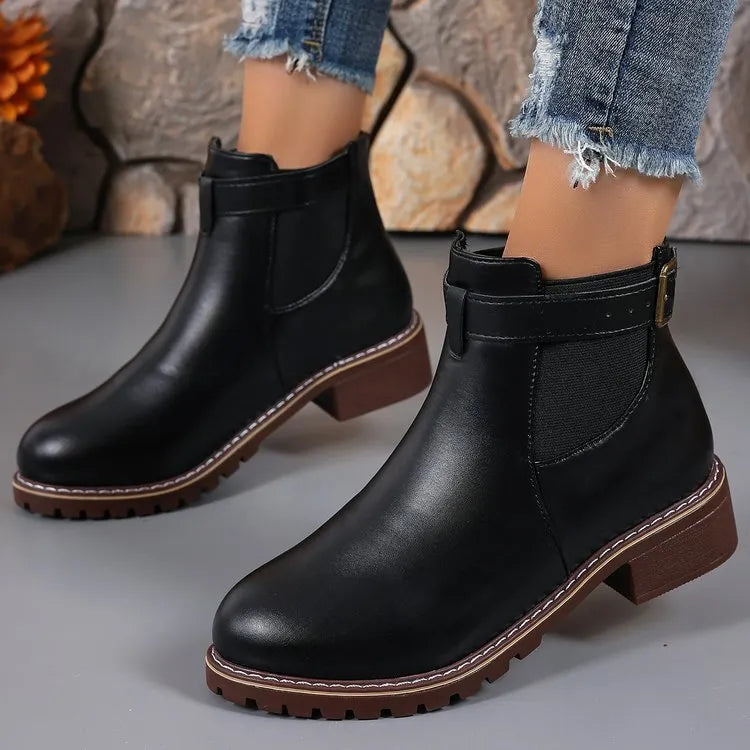 Women's round toe ankle boots with belt buckle decoration in black or chocolate brown