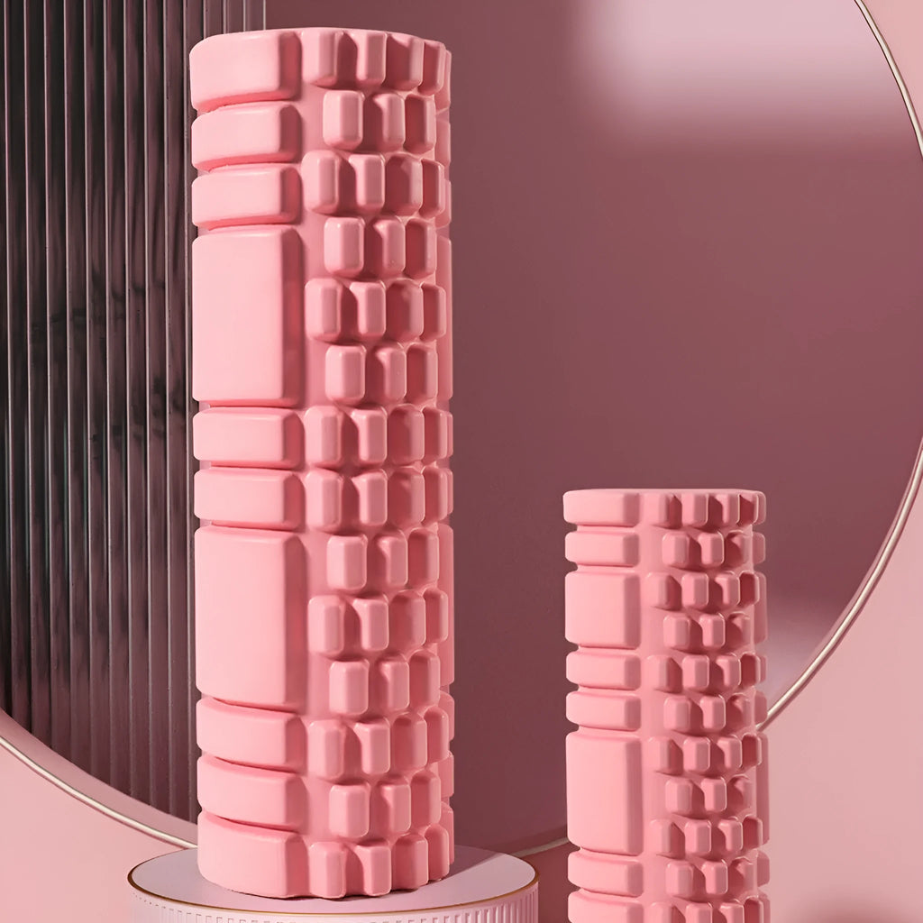 A firm EVA foam roller for fitness and muscle recovery, shown in a selection of colours including pink, blue, and grey.