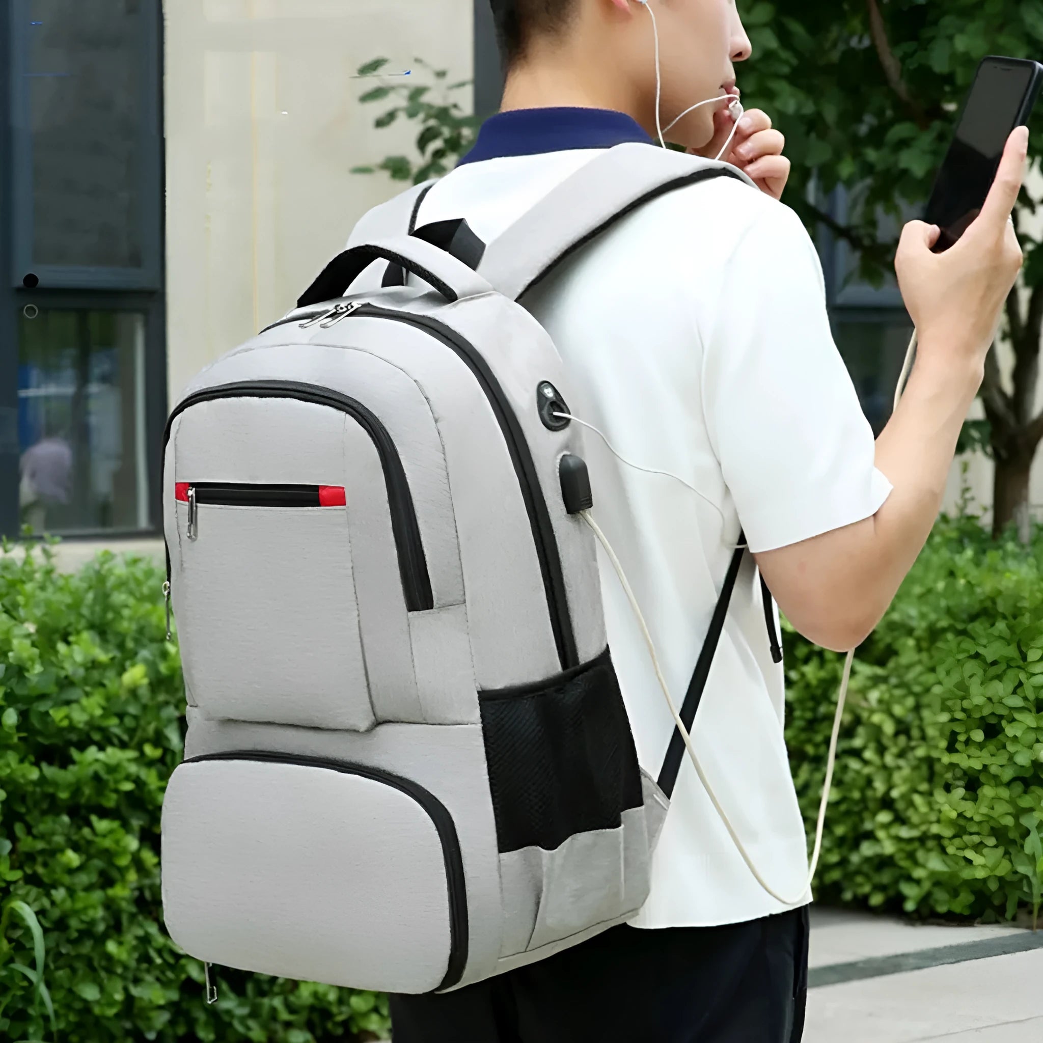Light grey Oxford cloth insulated picnic backpack with curved shoulder straps and a pull rod belt.