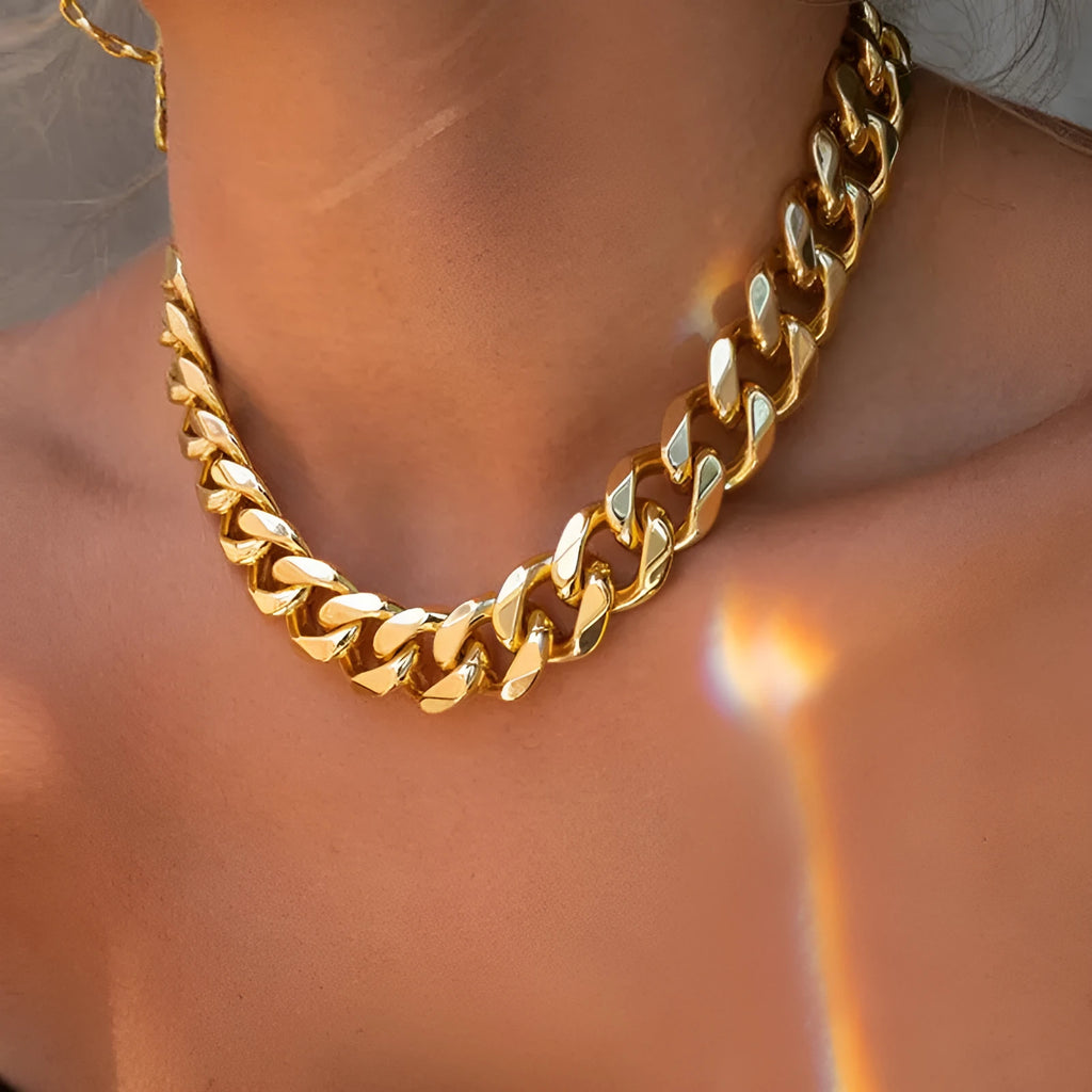 Gold-coloured women's thick chain alloy necklace with a pendant, showing its 32cm length.
