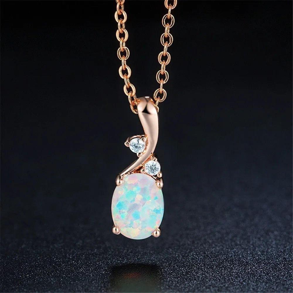 Water drop shaped opal pendant necklace on O-shaped chain in rose gold or white finish