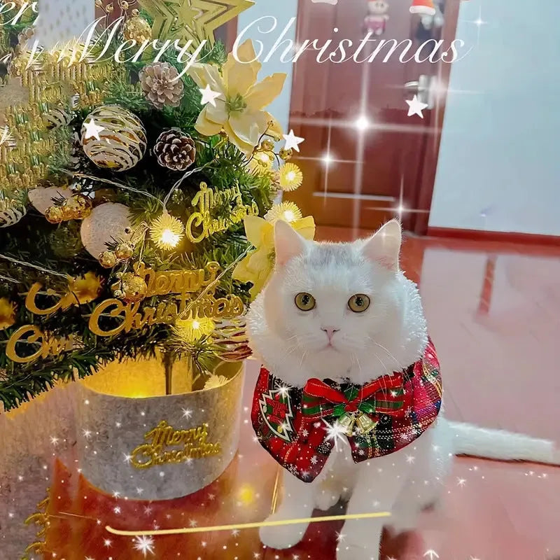 Red festive pet scarf with bell design on a dog, showing the polyester material and cloak-style fit.