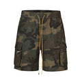 Man's green H215 camouflage cotton work shorts with multiple pockets shown in a loose fit.