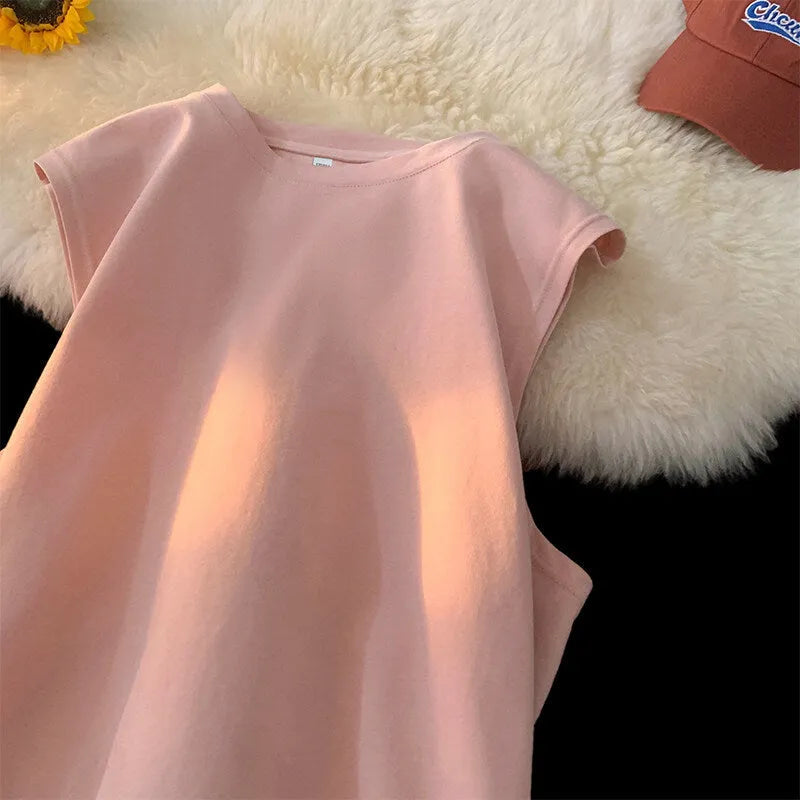 Men's loose cotton tank top in solid colours showing straight hem design and sleeveless cut