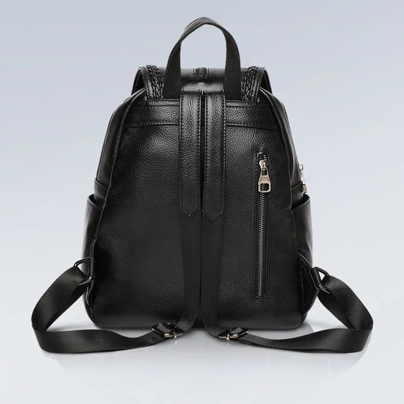 Genuine leather blue women's backpack showing front sandwich pocket and street trend design.