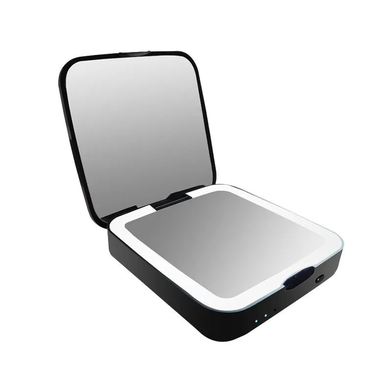 Black and white lighted makeup mirror showing standard and 4x magnifying circles with illuminated ring light.