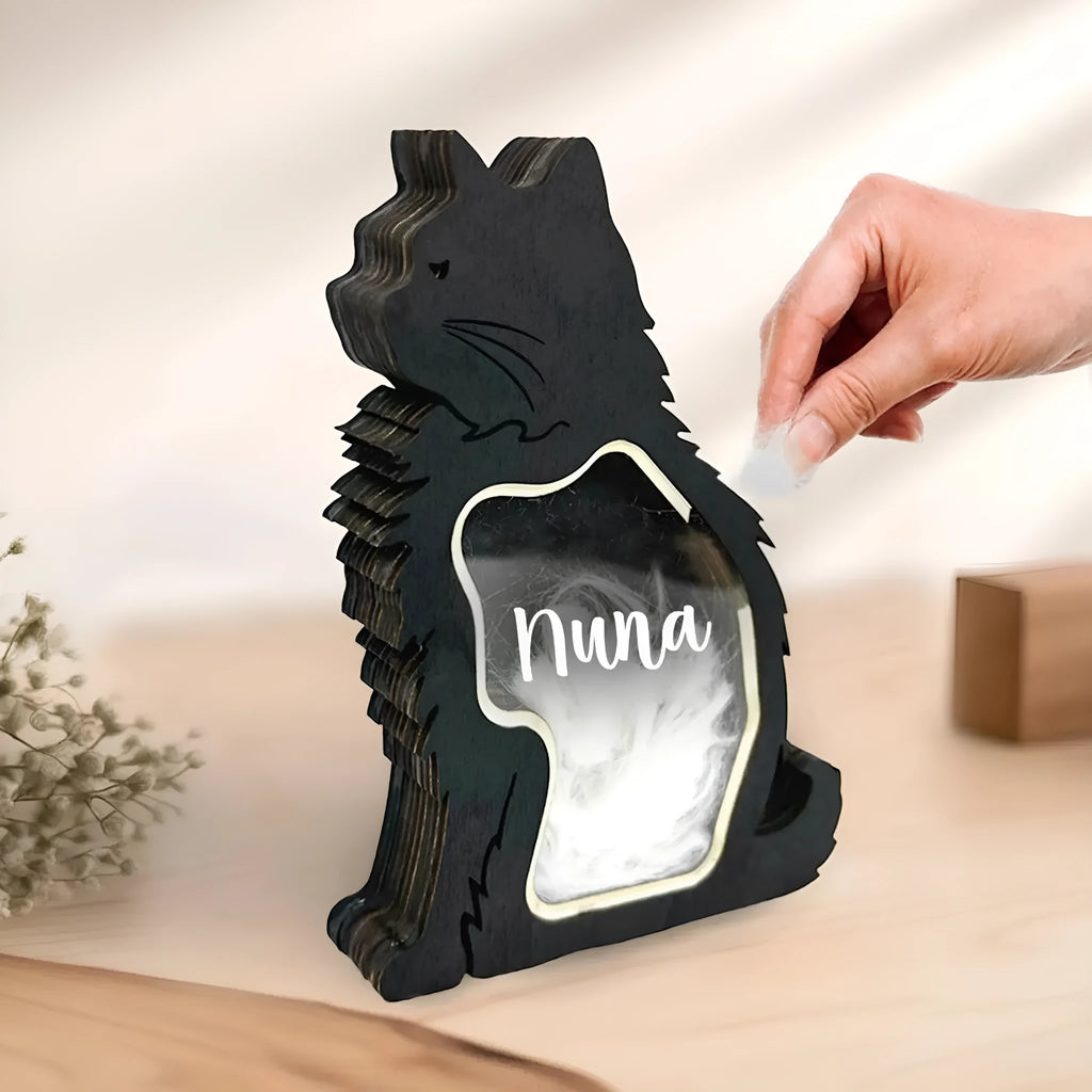 Black rectangular wooden box with a sliding lid for storing pet grooming tools.