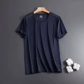 Man wearing a grey ice silk short sleeve crew neck t-shirt showing mesh fabric texture.