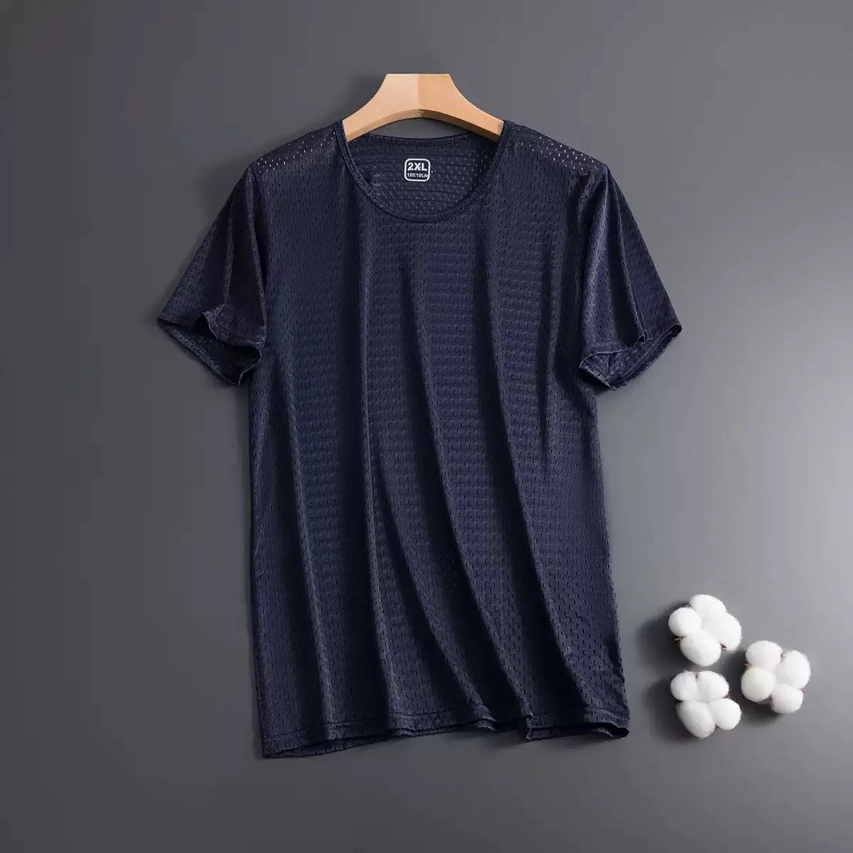 Man wearing a grey ice silk short sleeve crew neck t-shirt showing mesh fabric texture.