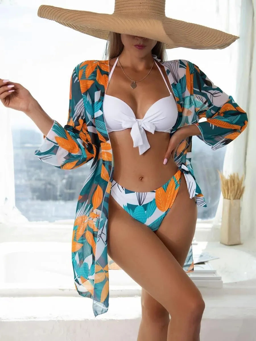 Women's three-piece bikini swimsuit set with mesh split design showing top, pants, and coat