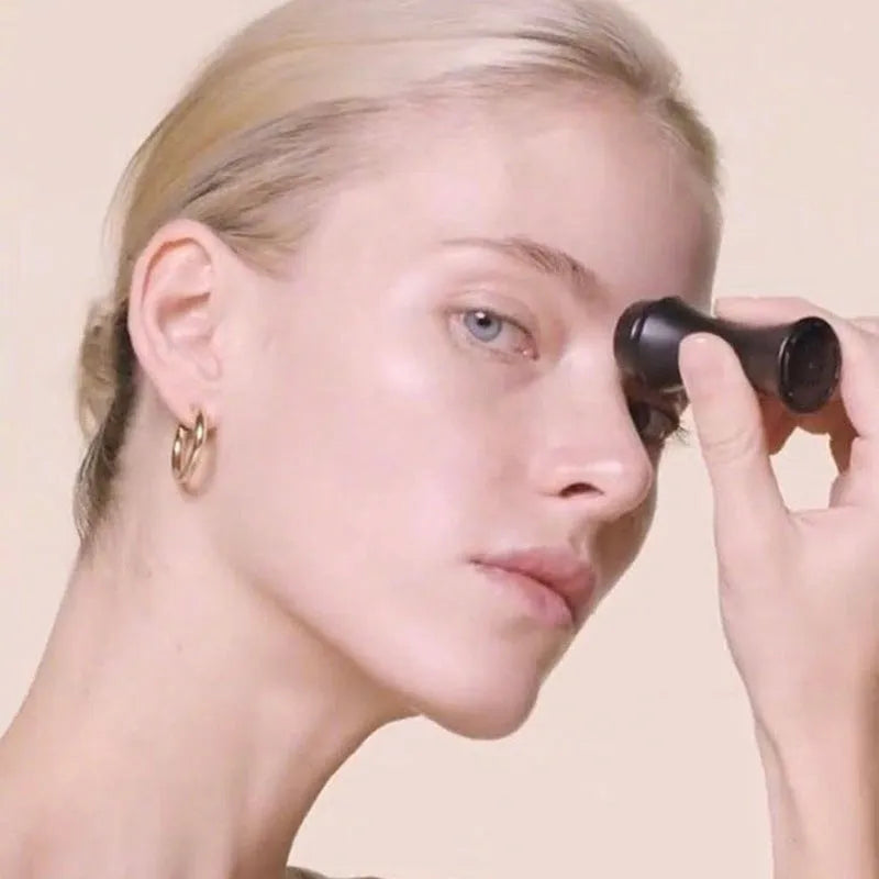 Portable volcanic stone facial roller for oily skin control in choice of colours.