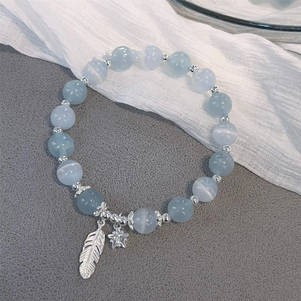 Glass crystal bead bracelet with blue moonlight colour and eight star design elements