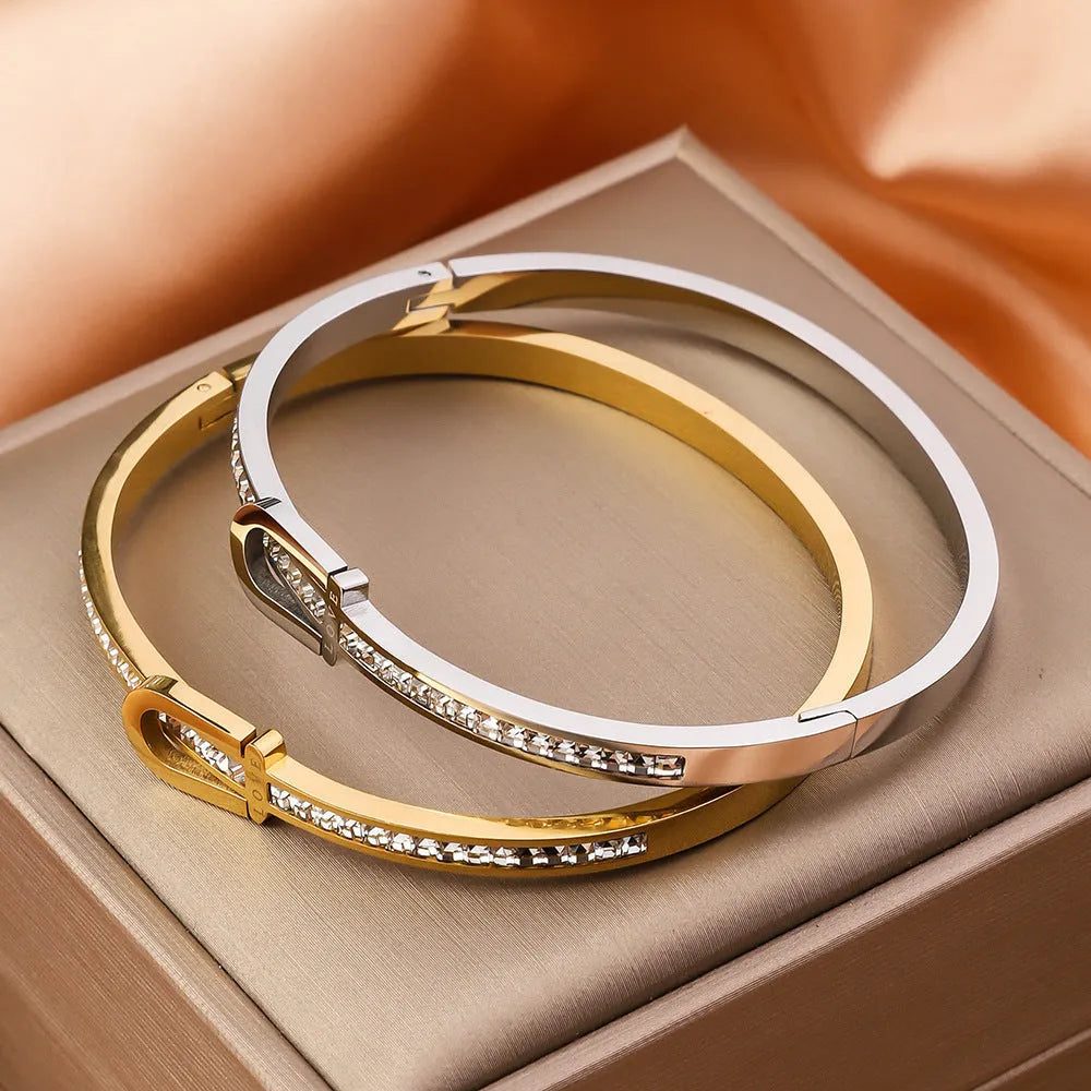 Gold plating titanium steel bracelet for women with electroplated finish, gold colour, on white background