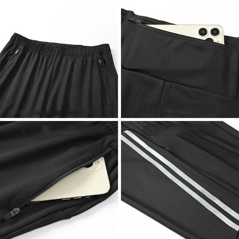 Men's black polyester running trousers with mid-waist, shown flat.