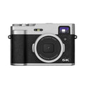 Black or brown 5K digital camera with dual lenses, a 2.88-inch screen, and an optical viewfinder on top.