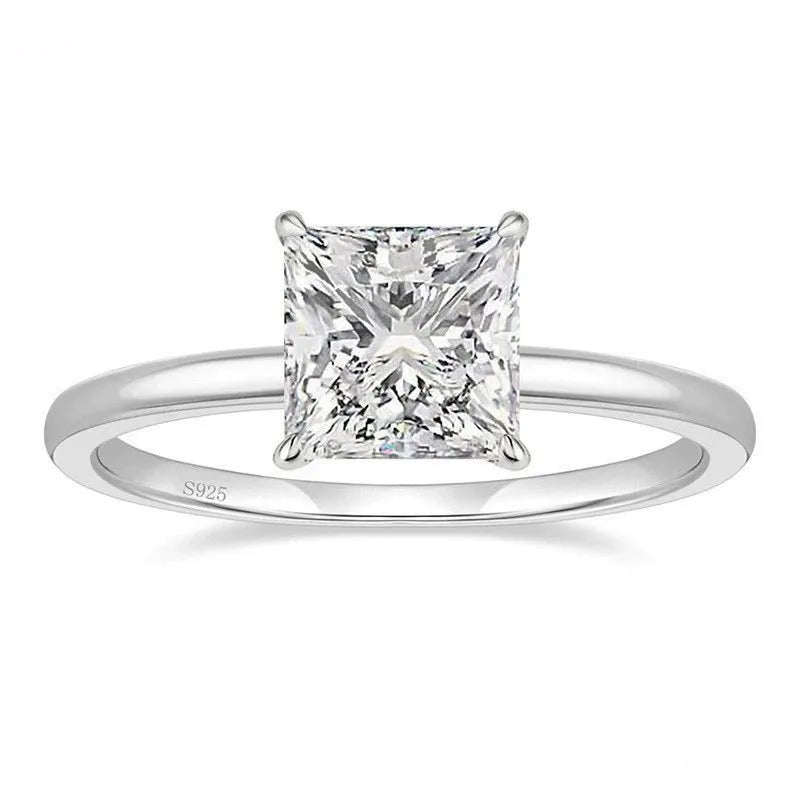 Sterling silver geometric women's ring with a round zirconia stone in silver, gold, or rose gold finish.