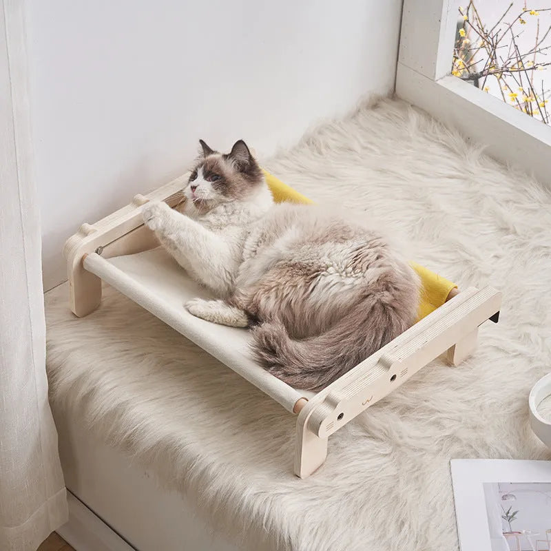 Solid wood cat bed with washable cover in grey-blue colour option on floor
