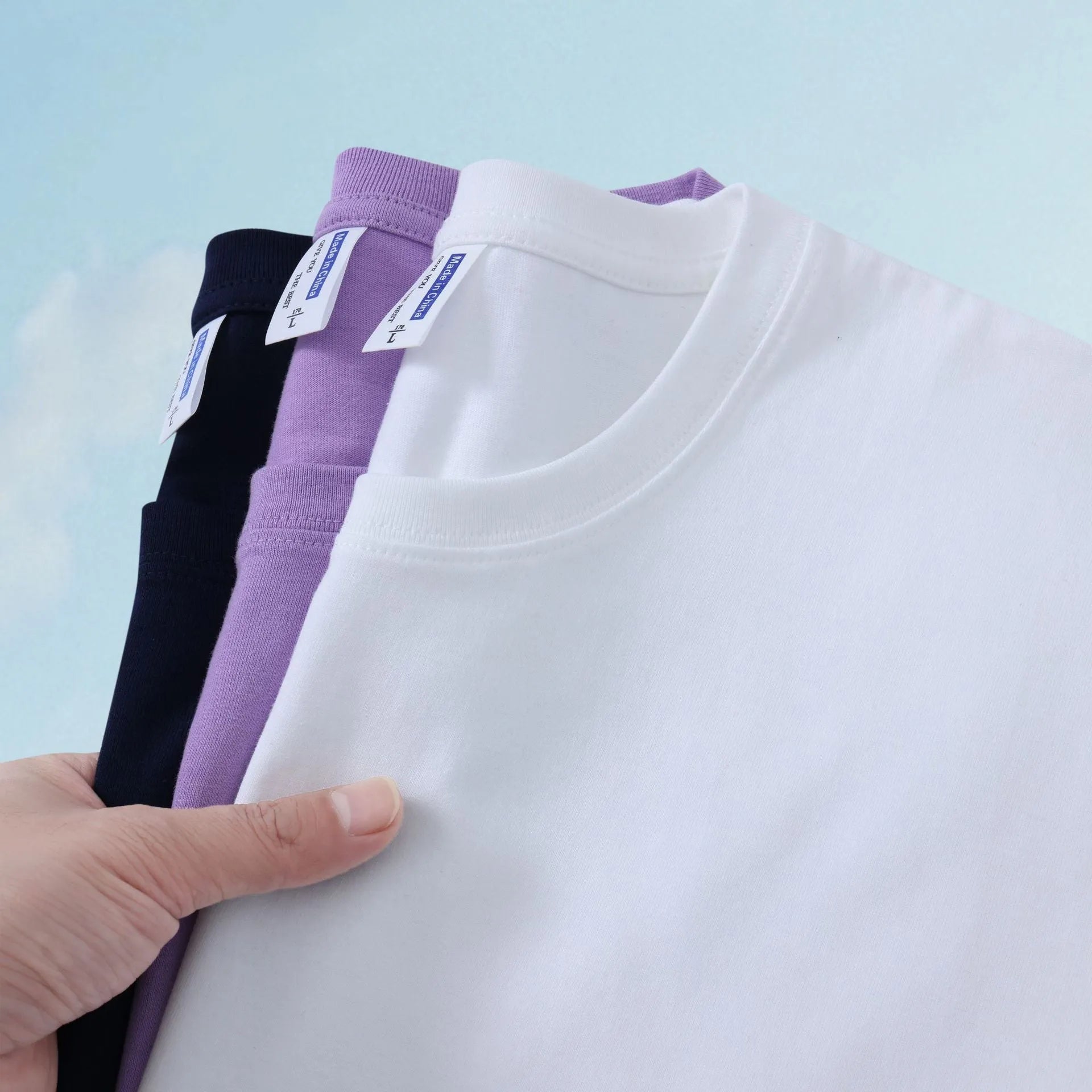 Loose-fit cotton T-shirt for men and women in multiple colour options including peacock blue and orange red.