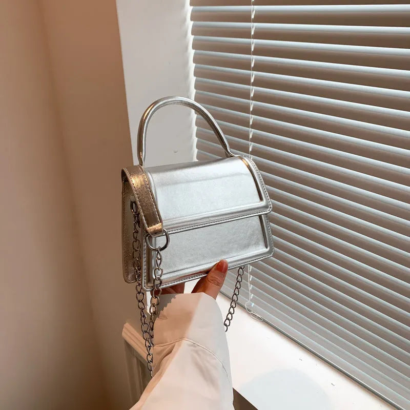 Retro PU leather shoulder bag in horizontal square shape with crossbody strap