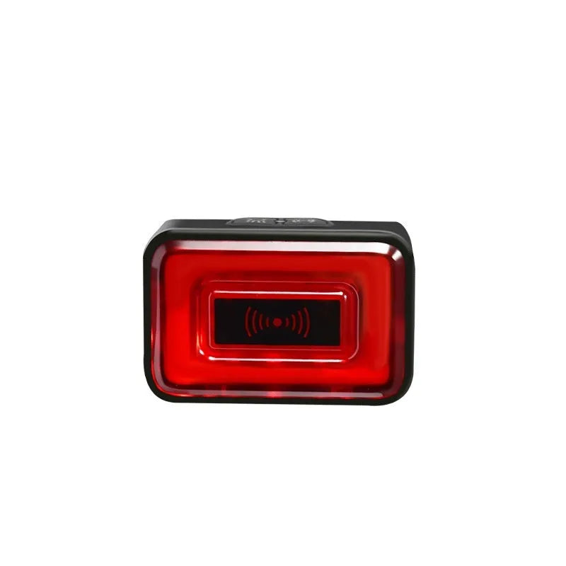 Smart millimetre wave radar bicycle taillight with mounting bracket on a black background.
