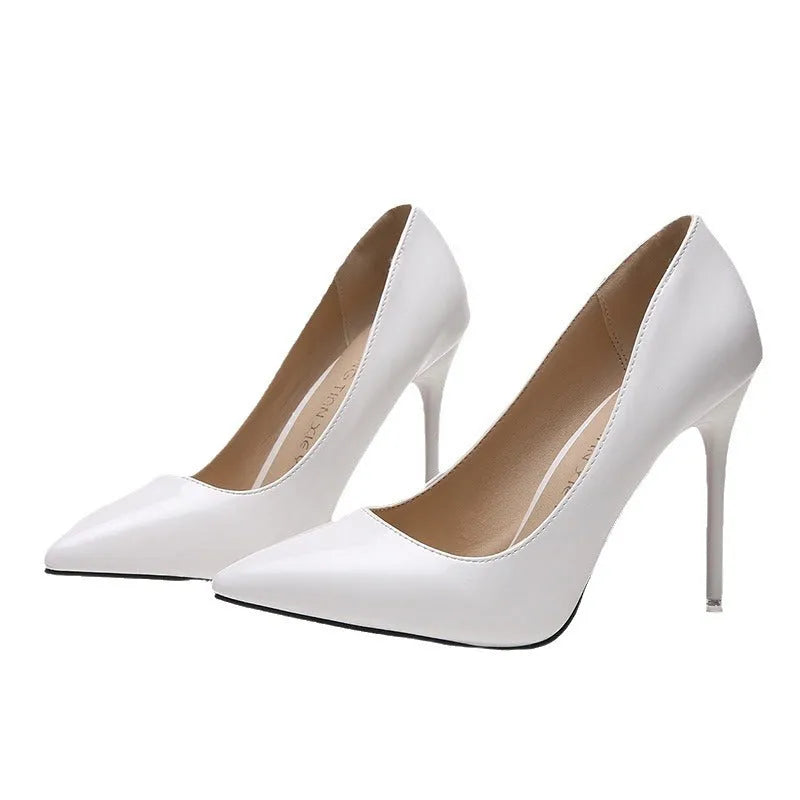 Women's pointed toe stiletto high heel pumps in apricot colour with a chunky heel and buckle detail.