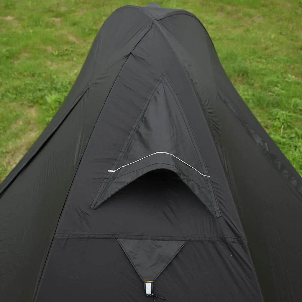 Black single person double account tent with aluminium poles pitched outdoors.