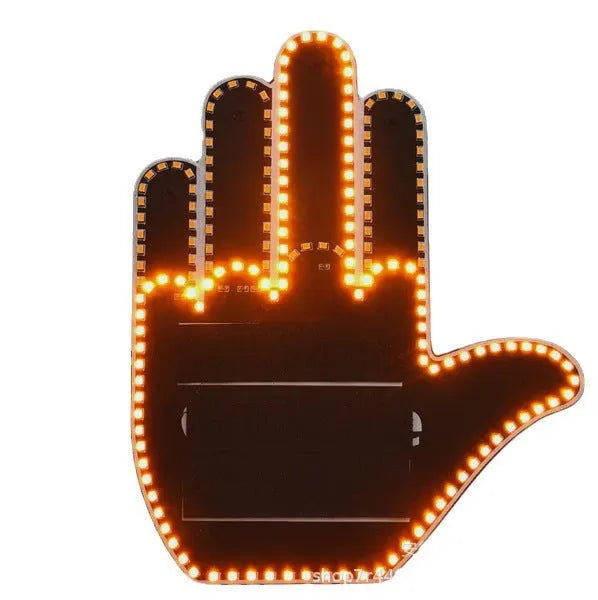 Black LED gesture car light with amber illumination showing hand gesture, remote control, and 3M Velcro mounting