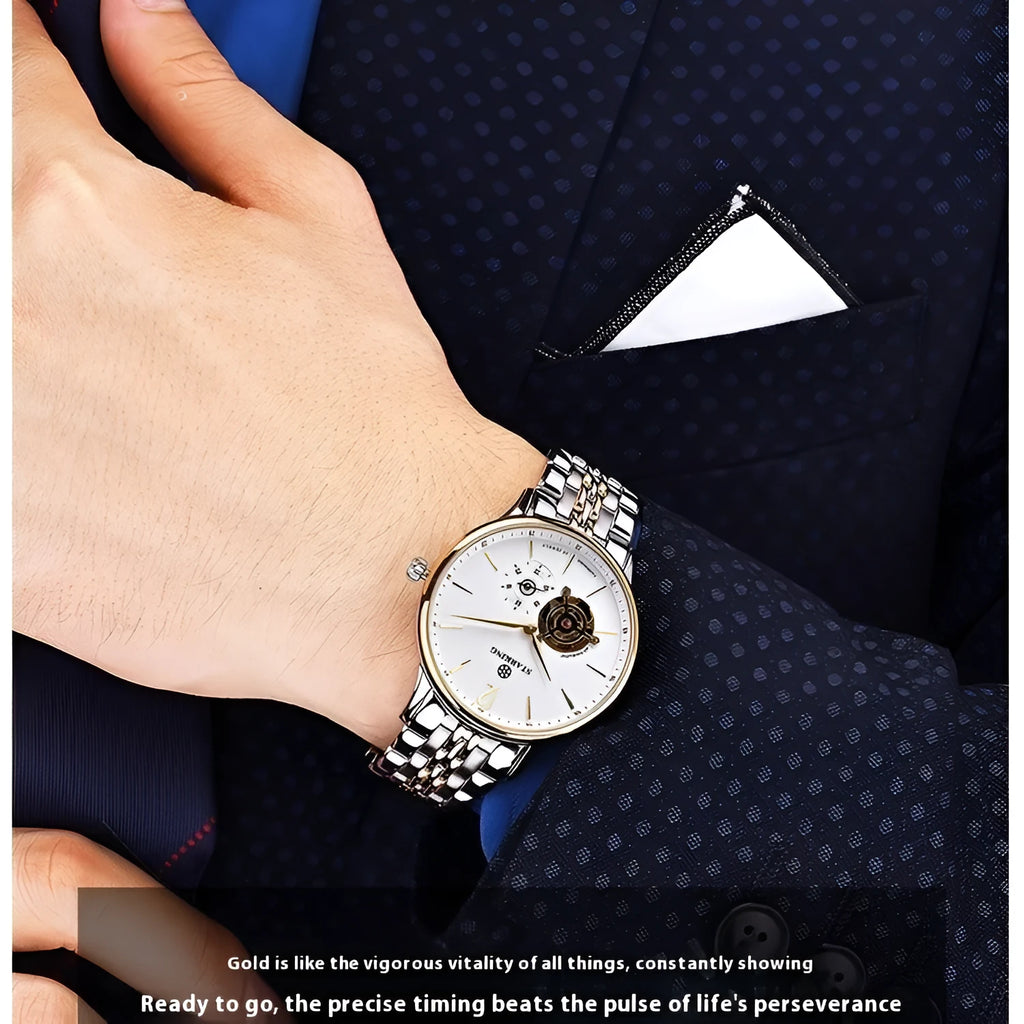 Men's automatic mechanical watch with brown leather strap and white dial on stainless steel case.