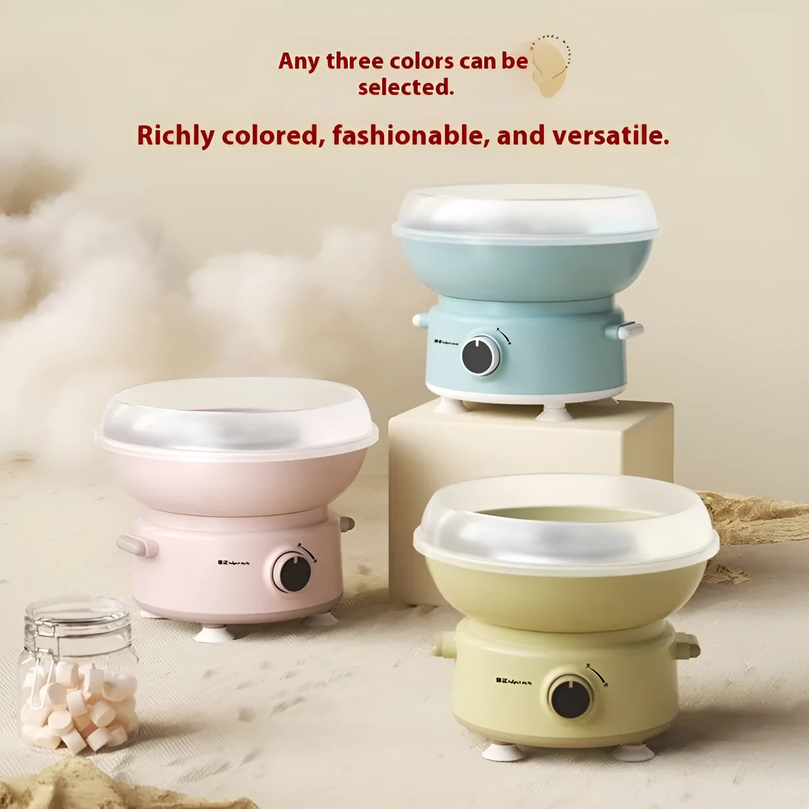 Mini cotton candy machine in blue with metal body and round heating tube on a countertop