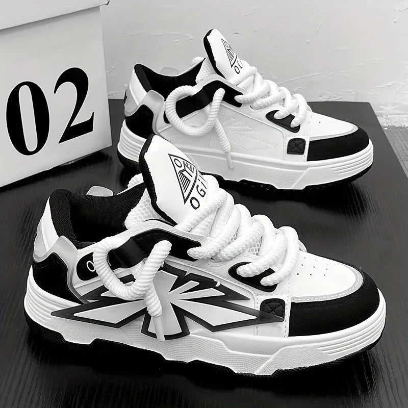 Men's white chunky sneakers with a cartoon pattern, round toe, and thick rubber sole on a plain background.
