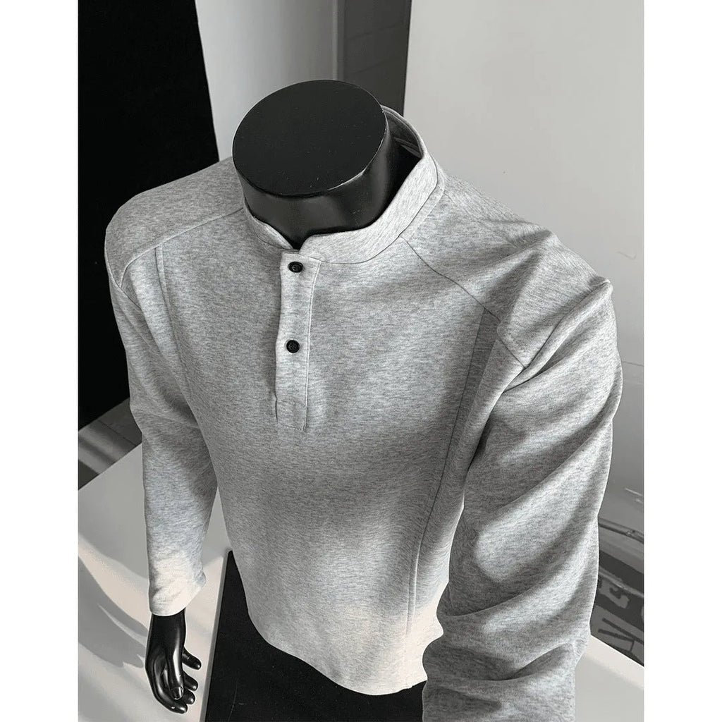 Men's grey asymmetric polo shirt with a patchwork stand-up collar and long sleeves.