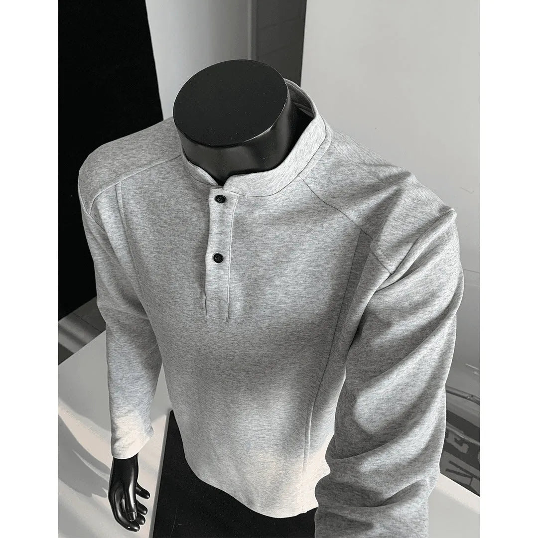 Men's grey asymmetric polo shirt with a patchwork stand-up collar and long sleeves.