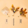 Three steel wire cat toy replacement heads in small flying insect designs with scratch-resistant surface