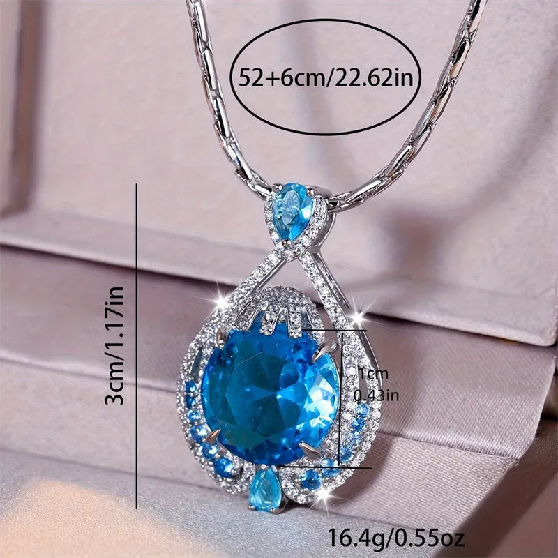 Blue geometric necklace with fireworks-cut crystal pendant on water wave chain