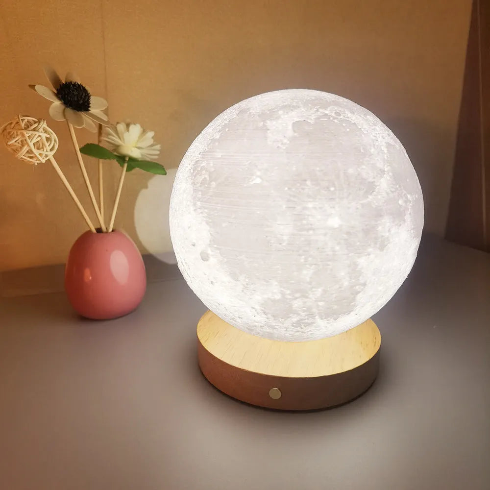 Rotating moon night lamp with wooden base showing three colour lighting options