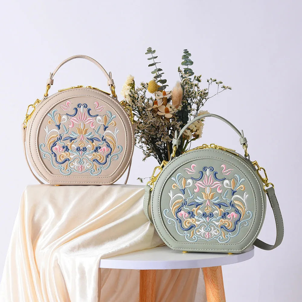 Round PU leather crossbody bag with embroidery and sewing line, available in five colours