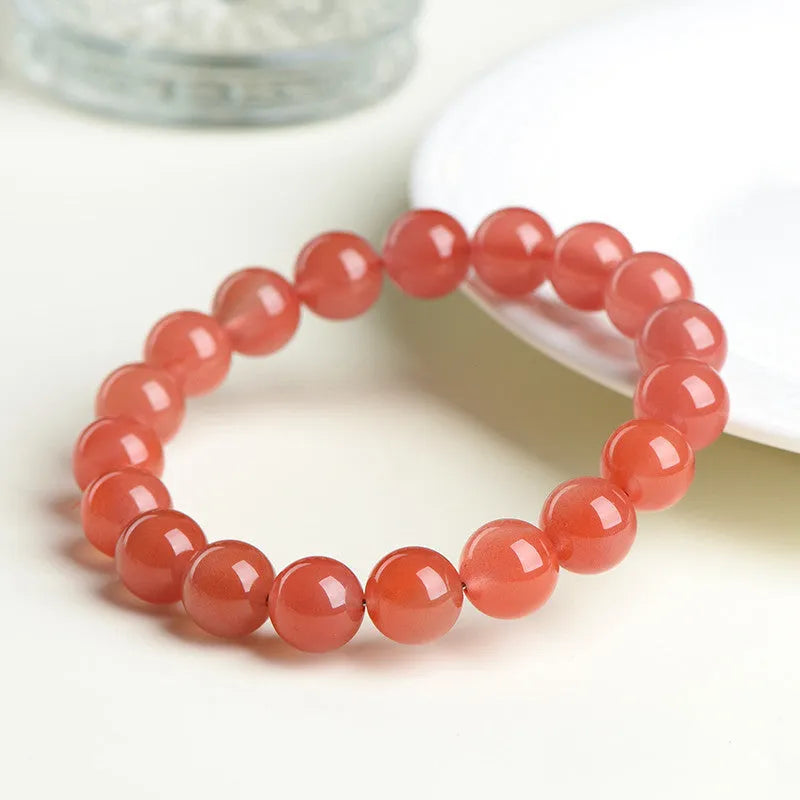 Natural cherry red agate bracelet with polished scattered beads, shown in a single circle style.