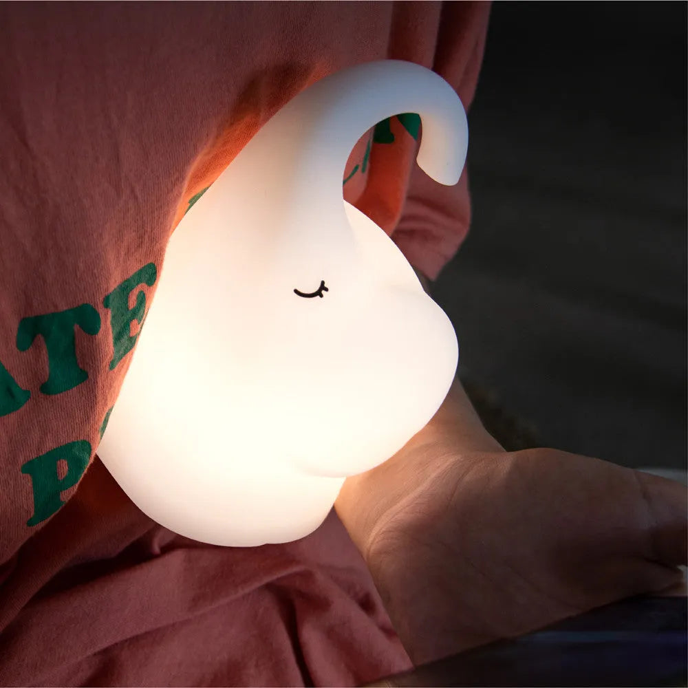 DOMI Elephant shaped night light with soft silicone body and warm white LED glow.