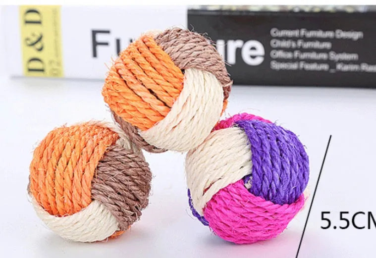 Natural sisal cat toy ball 6cm diameter for biting play on white background