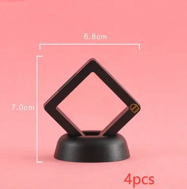 3D floating display case holding coins and jewellery between transparent membrane sheets