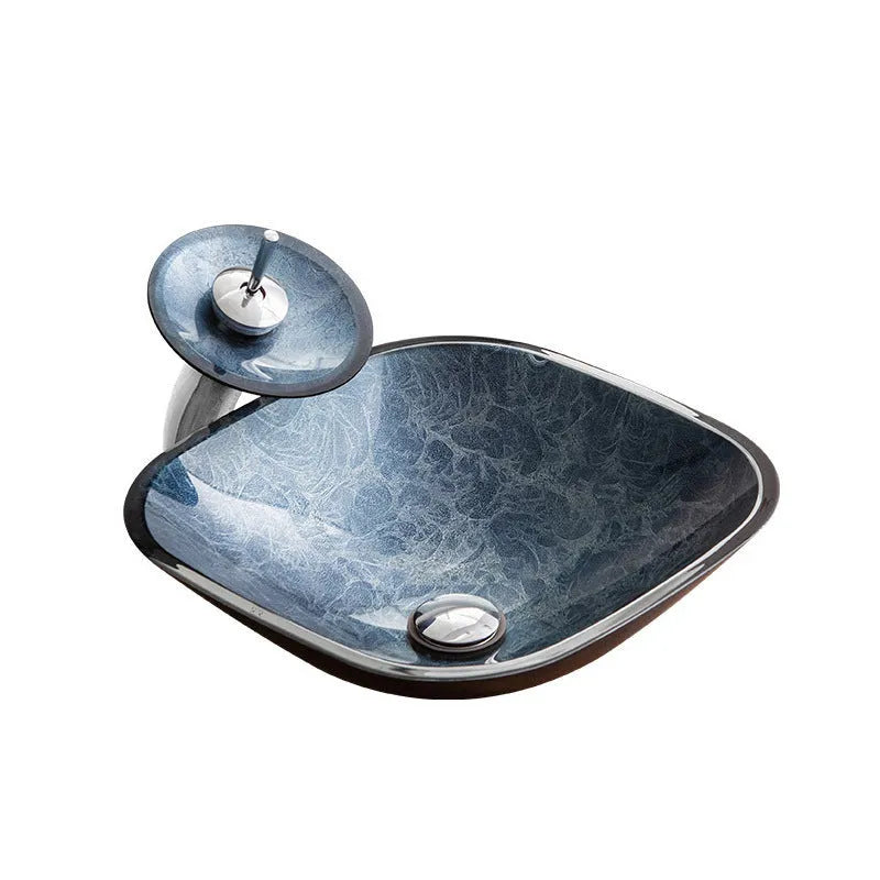 Blue grey tempered glass bathroom table basin with simple design on a vanity.