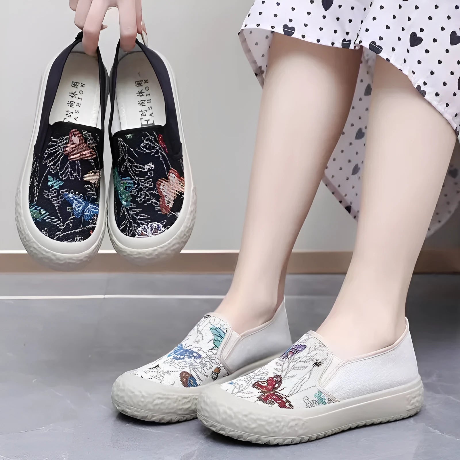 Women's slip-on canvas shoes in Black with round toe and decorative sewing thread details