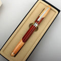 Wooden barrel and metal body pen with a grey fabric storage bag.